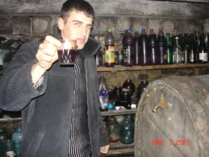 Vasya offers some homemade wine    photo: Jett Thomason
