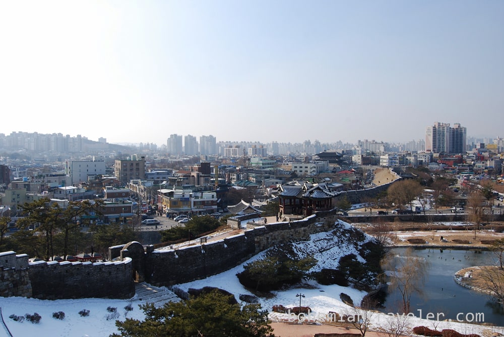 Hwaseong Fortress extending through the modern city of Suwon.